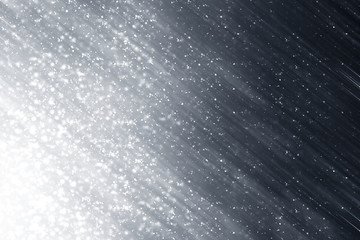 Snowflakes rays and bokeh or glitter lights on silver background. Christmas abstract template