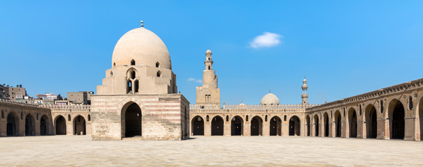 Courtyard of Ibn Tulun Mosque, Cairo, Egypt. View showing the ablution fountain, minaret and...