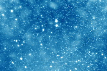 Abstract round blue bokeh or glitter lights on festive background. Circles defocused particles