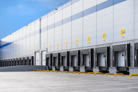 A large distribution warehouse with gates for loading goods