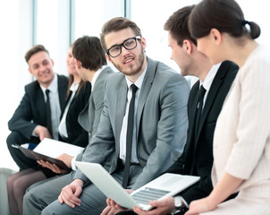 Fototapeta premium business team with laptop and documents sitting in the lobby bef