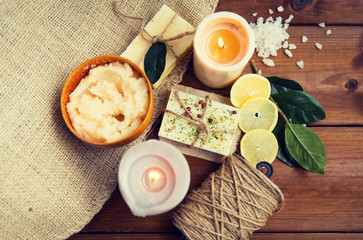 close up of natural soap and candles on wood