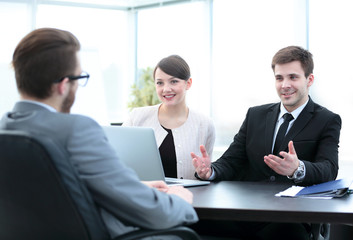 commercial Director discusses current issues with employees of t