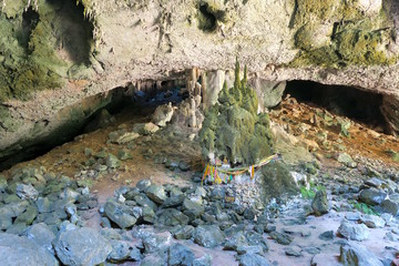 small buddhist statues near holy rocks, Thailand