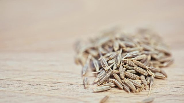 cumin lying on a wooden Board.