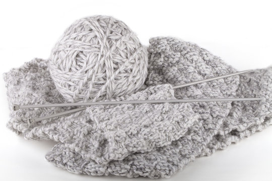 Knitting of handmade scarf. Isolated on white background.
