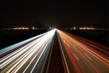 Fototapeta na wymiar light trails on highway symmetrical
