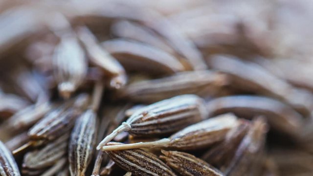 cumin lying on a wooden Board.
