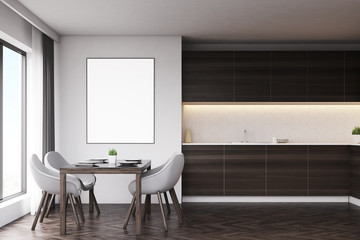 Dark wood kitchen with table and poster