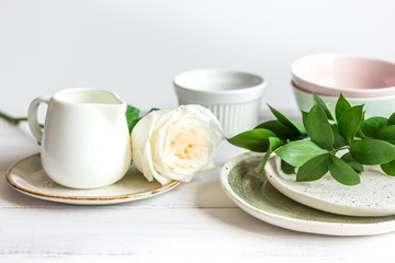 ceramic tableware with flowers on white background