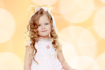 Fototapeta premium Little girl with curly hair.