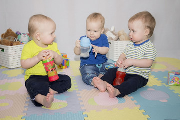 3 boys with baby water bottles