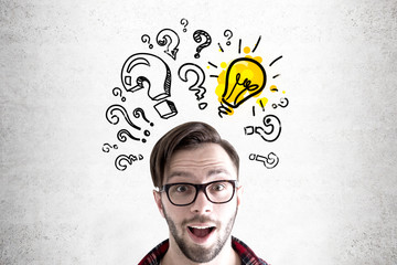 Hipster guy, bulbs and question marks