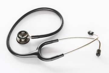 Grey and Silver Doctors Stethoscope on White Desk