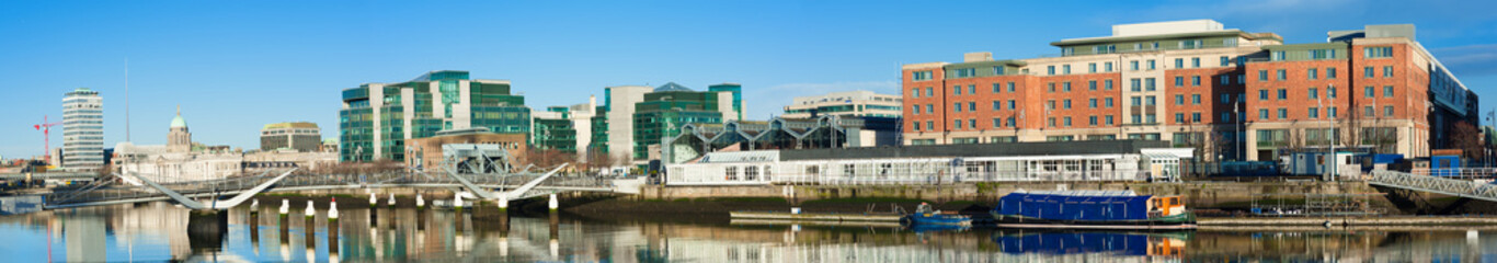 Fototapeta na wymiar Dublin, Ireland, panoramic view over Liffey river with modern buildings