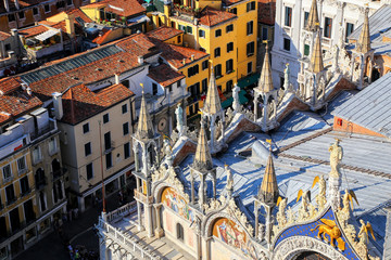 Fototapeta na wymiar Close view of St Mark's Basilica rooftop from St Mark's Campanile in Venice, Italy