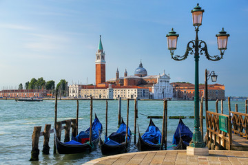 Gondolas moored near San Marco square across from San Giorgio Maggiore island in Venice, Italy