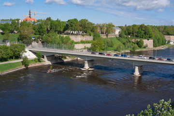 Fototapeta premium Bridge of Friendship with pedestrian tunnel over Narova River between Narva in Estonia and Ivangorod in Russia.