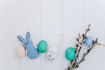 Easter concept. greeting card, eggs  and presents, rabbit on a white background
