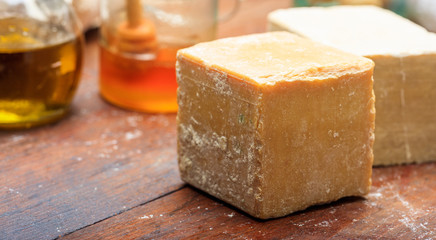Handmade soap bars on wooden background