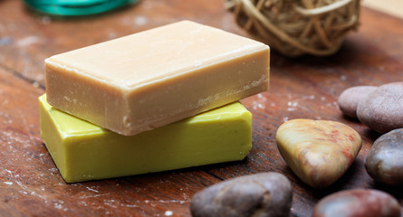 Handmade soap bars on wooden background