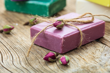 Handmade soap bar on wooden background