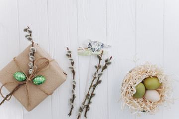 Easter concept. greeting card, eggs  and presents, rabbit on a white background
