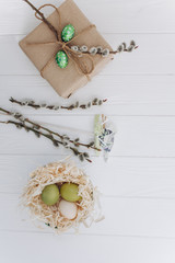 Easter concept. greeting card, eggs  and presents, rabbit on a white background