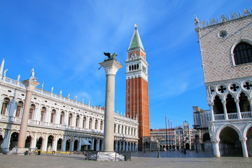 Fototapeta na wymiar View of Piazzetta San Marco with St Mark's Campanile, Lion of Venice statue, Biblioteca and Palazzo Ducale in Venice, Italy
