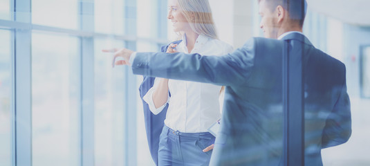 Smiling successful business team standing in office