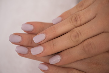 woman fingers with french manicure