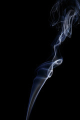 Abstract art. Color white blue smoke from the aromatic sticks on a black background. Background for Halloween. Texture fog. Design element. The concept of aromatherapy.