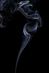 Abstract art. Color white blue smoke from the aromatic sticks on a black background. Background for Halloween. Texture fog. Design element. The concept of aromatherapy.