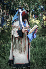 shaman performs a ritual