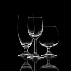 Shot of empty crystal wineglasses on black isolated.