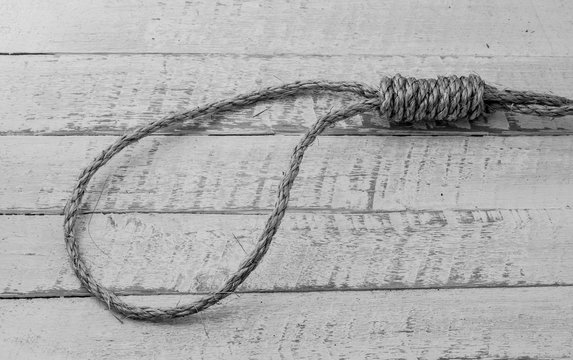 Rope loop on plank wood table background