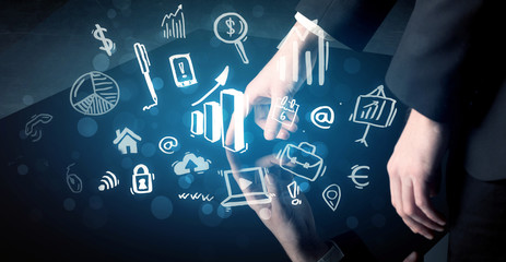 Man touching technology smart table with business icons