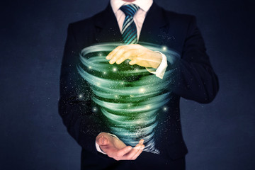 Businessman holding green tornado