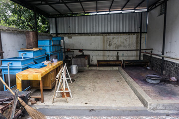 An empty workshop for Batik production process with tools, table and broom stick photo taken in Batik Museum Pekalongan Indonesia