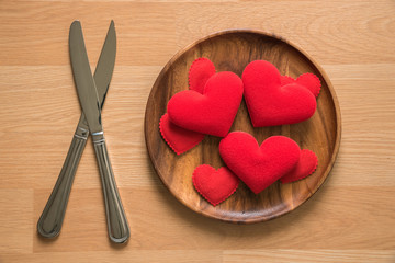 red heart in wooden dish