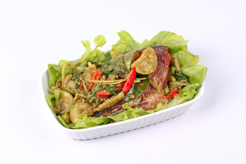 Green tilapia fish curry in coconut milk .