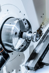 metal workpiece clamped in the lathe chuck CNC machine