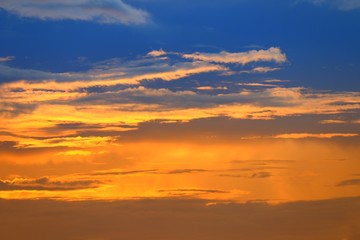 Fototapeta na wymiar sunset beautiful colorful light gold in blue sky