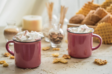 two cups of cocoa with marshmallows