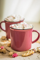 two cups of cocoa with marshmallows