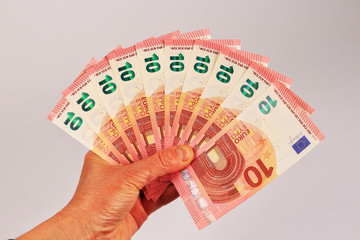 Ten euro banknotes in the hand