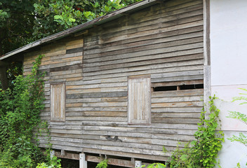Old abandoned wooden house with broken