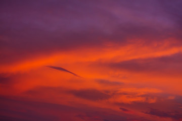 Nature background. Red sky at night and clouds. Beautiful and colorful sunset time.