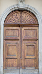 The vintage brown  wooden front door of an old house