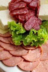    Sausage slices with lettuce leaf 